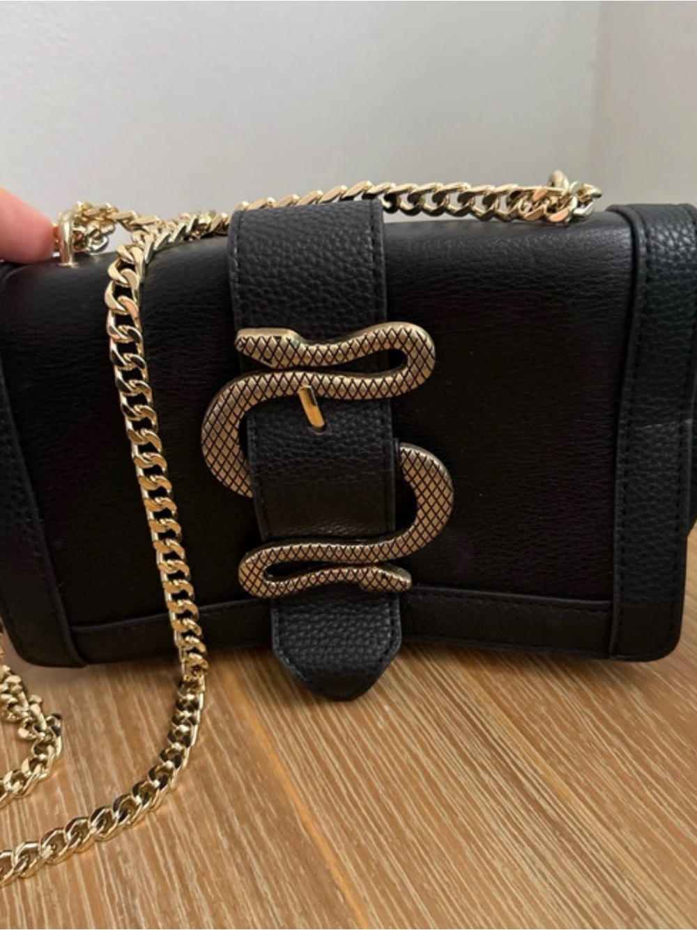 Express Black Crossbody Bag with Gold Snake Accent